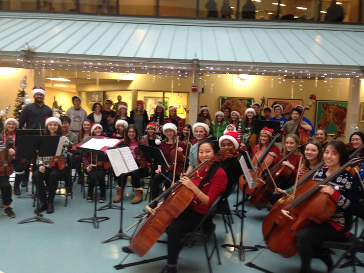 students playing in orchestra