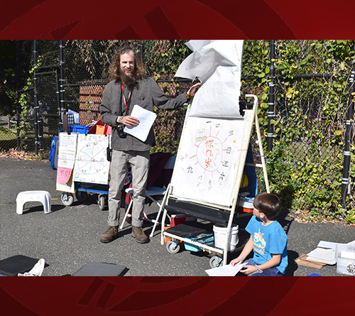 A boy teaching student