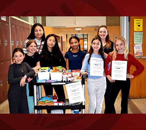 6th Grades smiling with their classmates