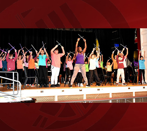Students at the stage performing