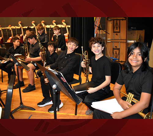 Students at the stage performing