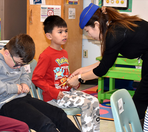 student with the teacher watching tour