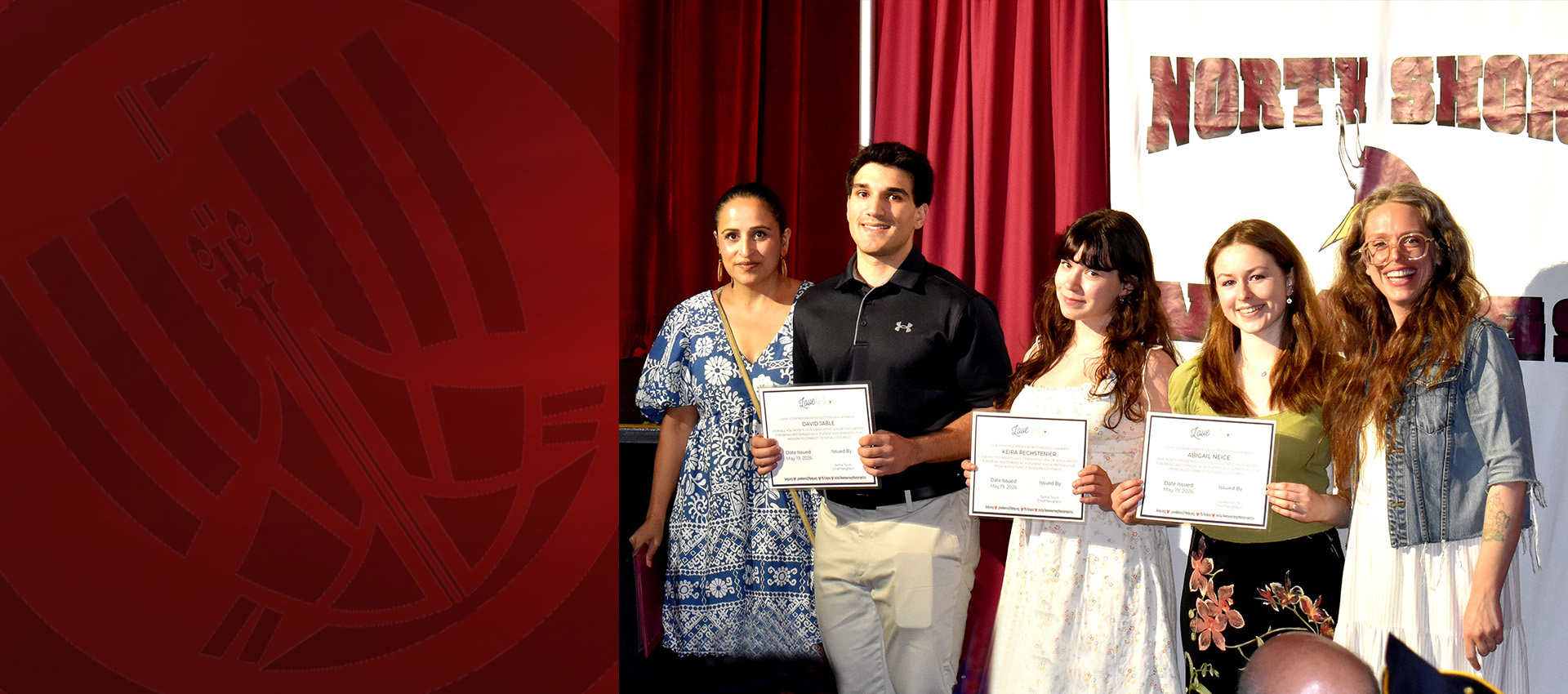 Students and teachers posing with certificates during a North Shore school recognition event.